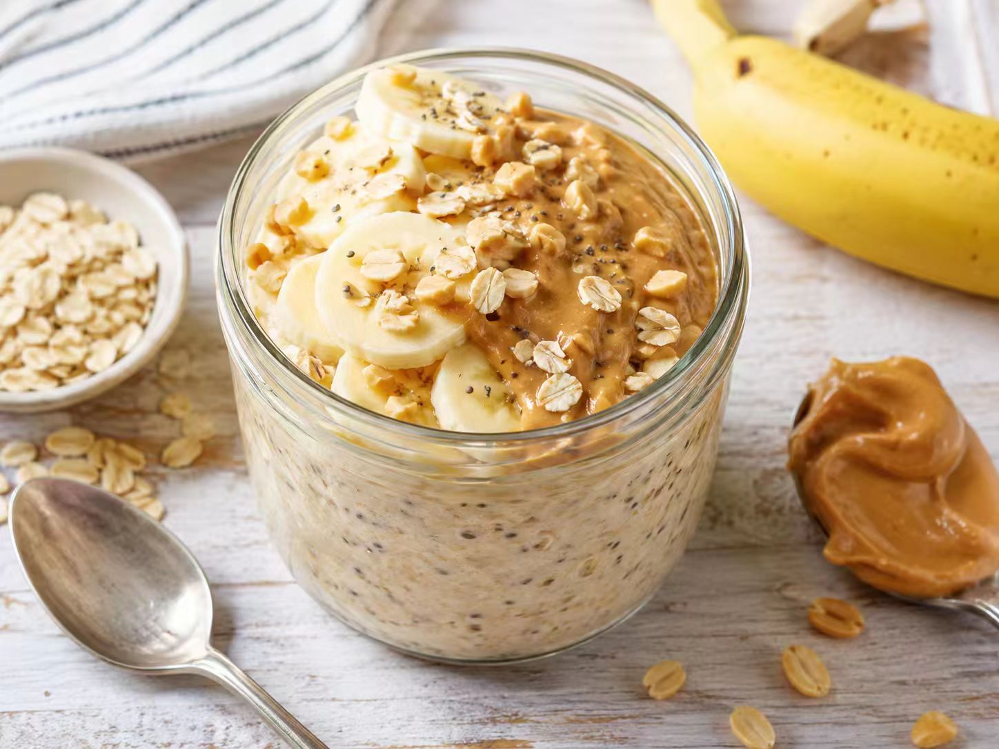 Peanut butter banana overnight oats in a jar with banana slices